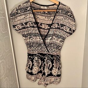 Black and cream romper, button in neckline, size S